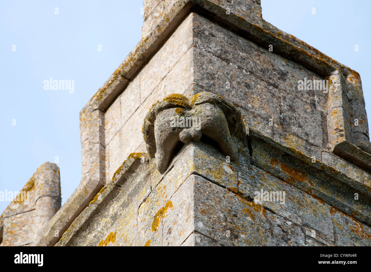 Rude carving on tower of St Michael`s Church, Gunby, Lincolnshire, England, UK Stock Photo